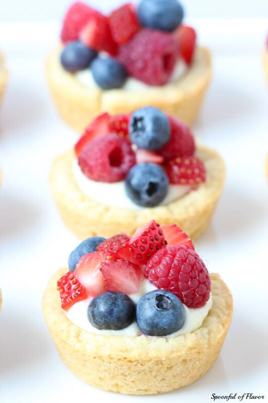 Triple Berry Lemon Cookie Cups - fresh lemon cream and berries sits on top of a delectable lemon sugar cookie crust! The entire family will love them!