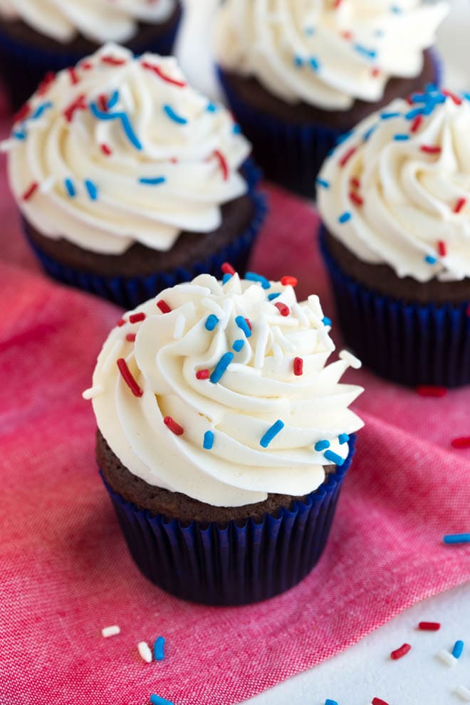 Simple chocolate cupcakes with vanilla buttercream are a favorite classic cupcake recipe! Impress your guests with this simple chocolate cake and sweet buttercream frosting.