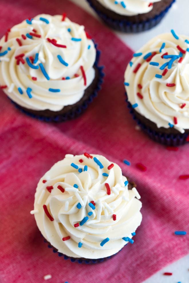 Simple chocolate cupcakes with vanilla buttercream are a favorite classic cupcake recipe! Impress your guests with this simple chocolate cake and sweet buttercream frosting.