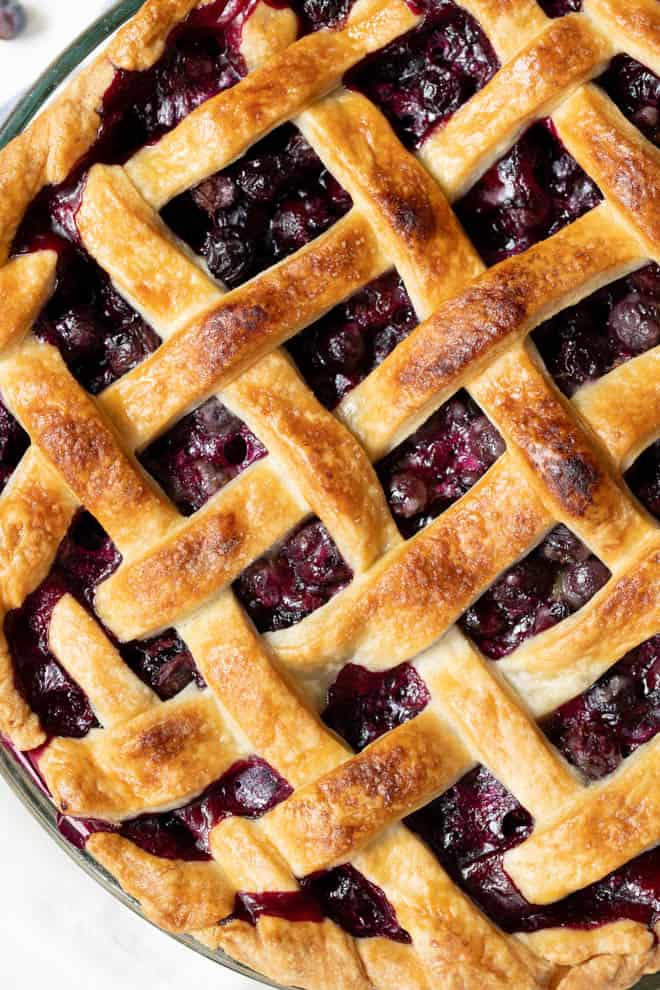 a baked blueberry pie with a lattice topping