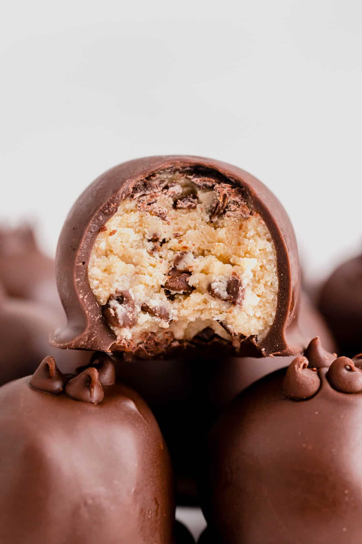 a bite taken out of a cookie dough truffle