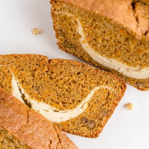 slices of carrot loaf cut on a white counter