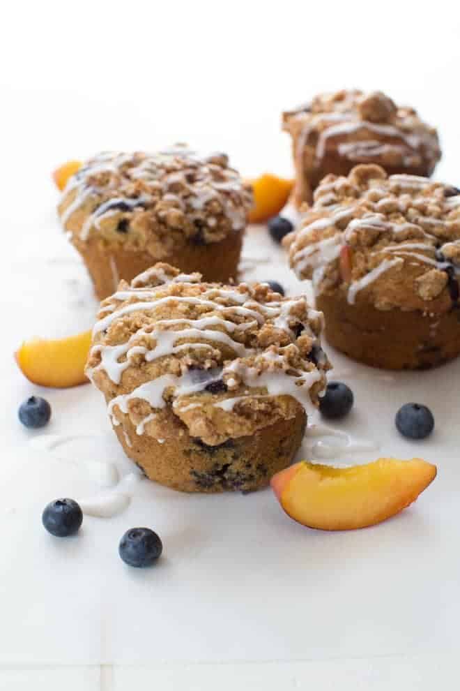 Blueberry Peach Cobbler muffins are perfect for the summer season! This recipe makes jumbo sized muffins full of juicy peaches and ripe blueberries!