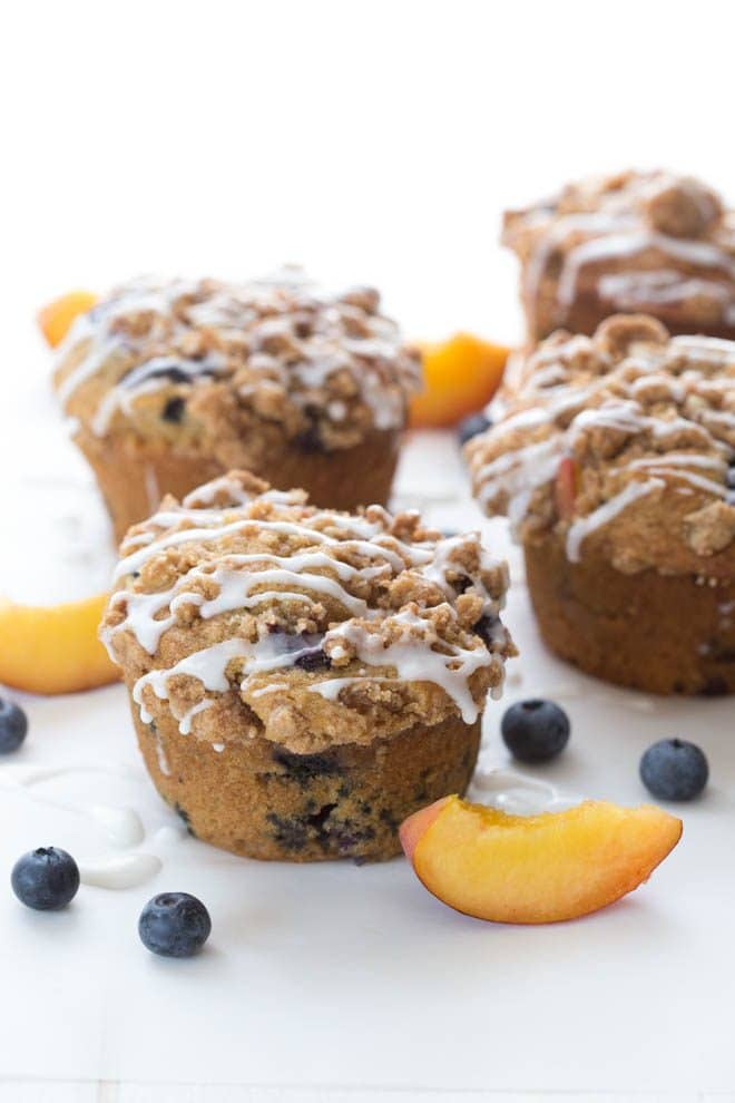 Blueberry Peach Cobbler muffins are perfect for the summer season! This recipe makes jumbo sized muffins full of juicy peaches and ripe blueberries!