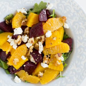 roasted beets, oranges, cheese and nuts in a salad