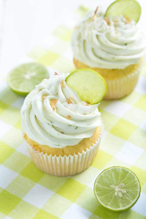 Coconut Cupcakes are stuffed with coconut filling and topped with key lime buttercream frosting! These cupcakes are too good to resist!
