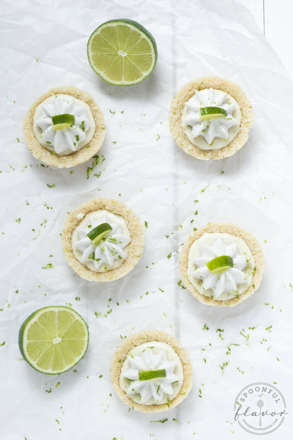 No Bake Mini Key Lime Pies - a layer of crust is filled with key lime filling and topped with whipped coconut cream! These little bites pies are gluten free, vegan, paleo and healthy!