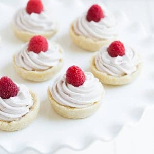 No Bake Raspberry Lemon Cookie Cups are a gluten free, dairy free, and vegan dessert! Made with coconut, lemon, raspberries and a few simple ingredients.