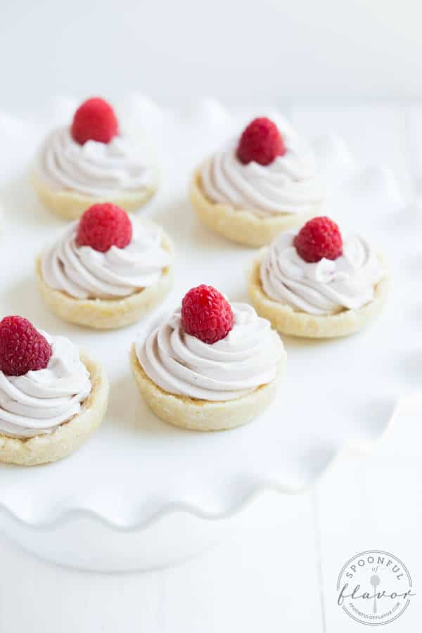 No Bake Raspberry Lemon Cookie Cups are a gluten free, dairy free, and vegan dessert! Made with coconut, lemon, raspberries and a few simple ingredients.