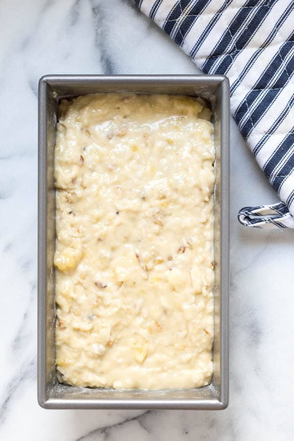 Banana Coconut Crunch Bread with Coconut Cream Icing - a simple quick bread that will add flavor to any morning!