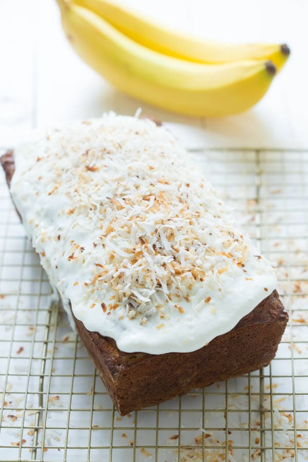 Banana Coconut Crunch Bread with Coconut Cream Icing - a simple quick bread that will add flavor to any morning!