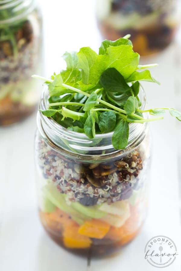 Fall Mason Jar Salad with Maple Balsamic Dressing includes roasted butternut squash, apples, dried cranberries, quinoa, toasted pumpkin seeds, and fresh greens!