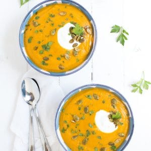 Roasted Butternut Squash and Red Lentil Soup is made with fresh, healthy ingredients and is garnished with Greek yogurt, pepitas and parsley!