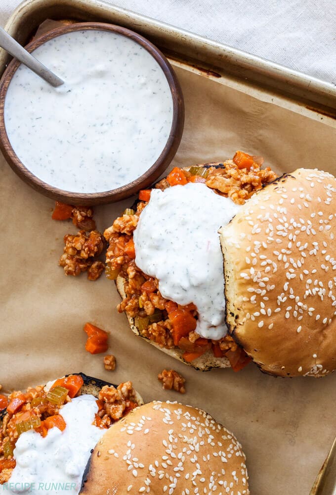Buffalo Chicken Sloppy Joes | Buffalo wing sauce fans will love these easy to make buffalo chicken sloppy Joes topped with blue cheese ranch sauce!