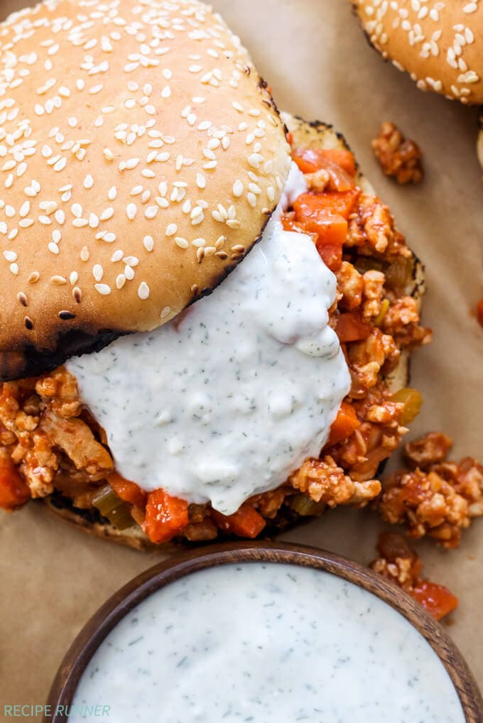 Buffalo Chicken Sloppy Joes | Buffalo wing sauce fans will love these easy to make buffalo chicken sloppy Joes topped with blue cheese ranch sauce!