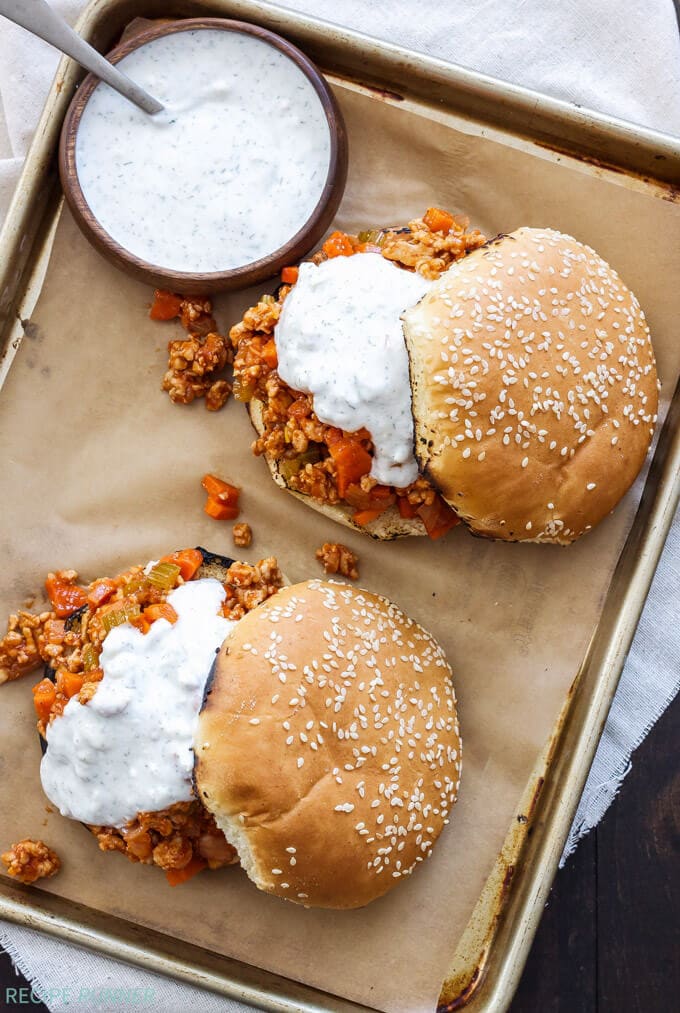 Buffalo Chicken Sloppy Joes | Buffalo wing sauce fans will love these easy to make buffalo chicken sloppy Joes topped with blue cheese ranch sauce!