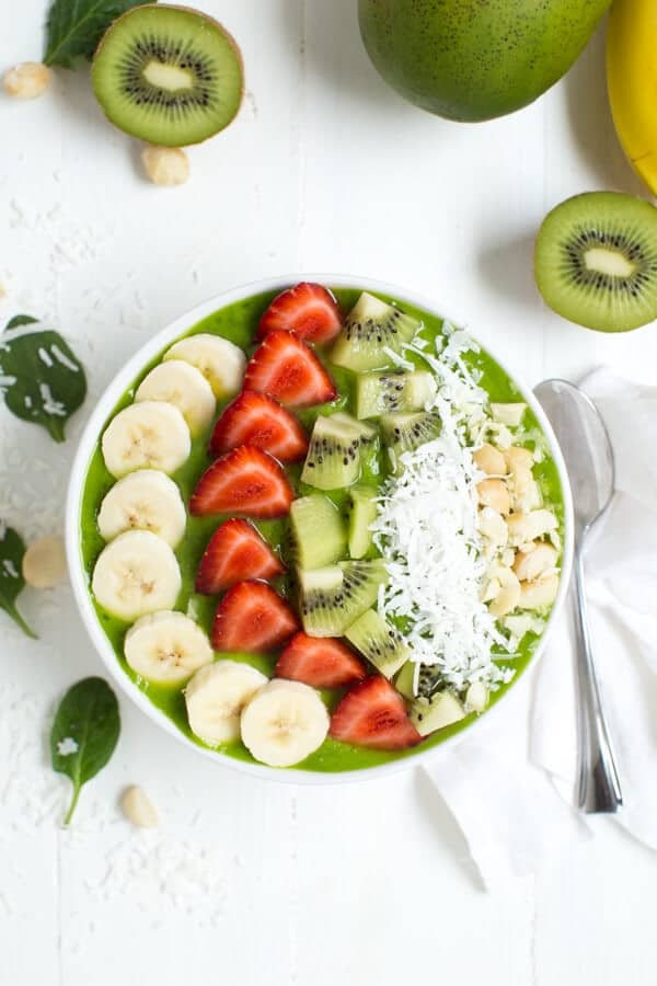 Tropical Green Smoothie Bowl is made with only a few delicious ingredients including pineapple, banana, mango, spinach and more!