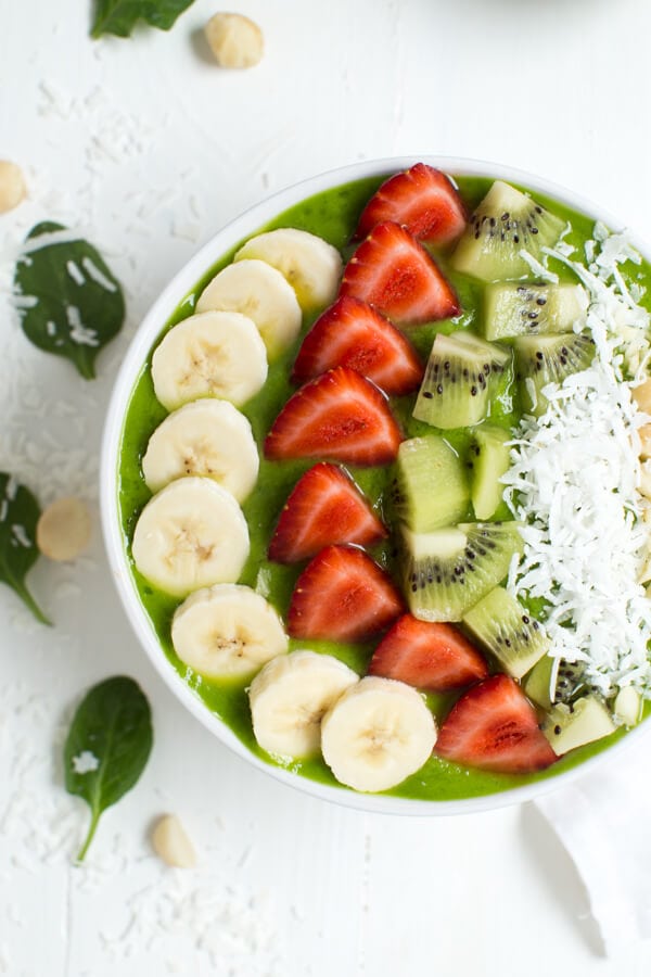 Tropical Green Smoothie Bowl is made with only a few delicious ingredients including pineapple, banana, mango, spinach and more!