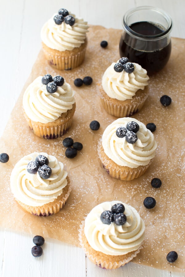 Blueberry French Toast Cupcakes are irresistible! A cinnamon maple cake is topped with maple buttercream frosting and fresh blueberries.