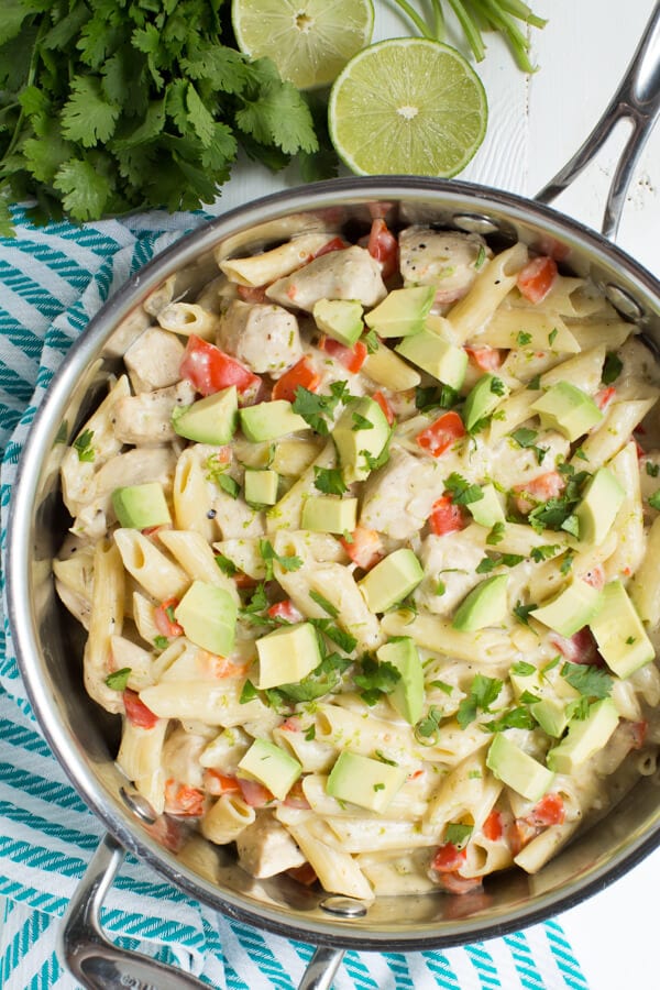 One Pot Creamy Salsa Verde and Lime Chicken Pasta is made with pasta, chicken, lime, tomatillo pasta and cheesy goodness! Everything cooks in one pot too.