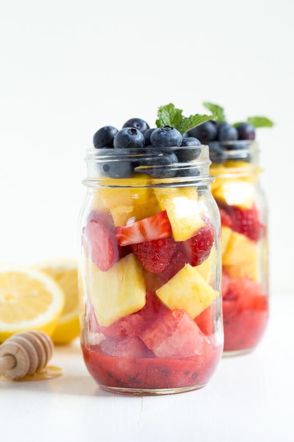 Mason Jar Fruit Salad with Strawberry Mint Dressing is made with the freshest flavors piled high in a mason jar. Kids and adults will love it!
