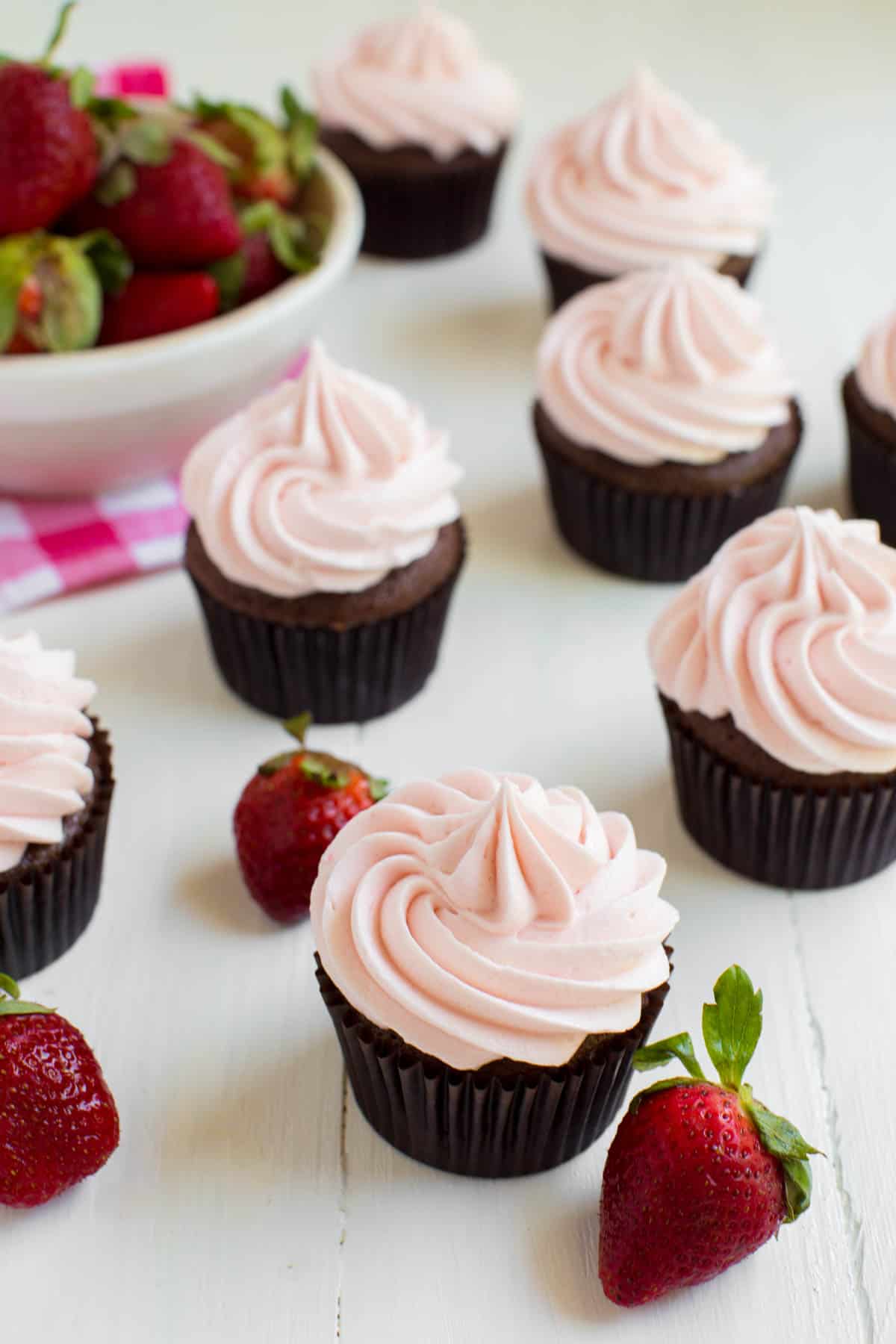 strawberry chocolate cupcakes on a white tabletop