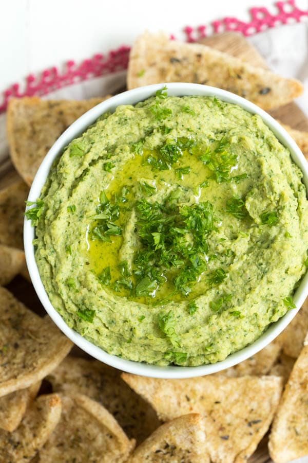 Lemon Spinach Hummus includes everything you love about hummus with the addition of spinach to create this snack packed with green goodness. Serve with homemade baked seasoned pita chips!