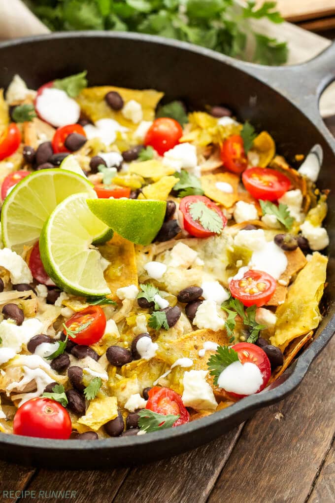 a skillet filled with easy chicken chilaquiles and toppings