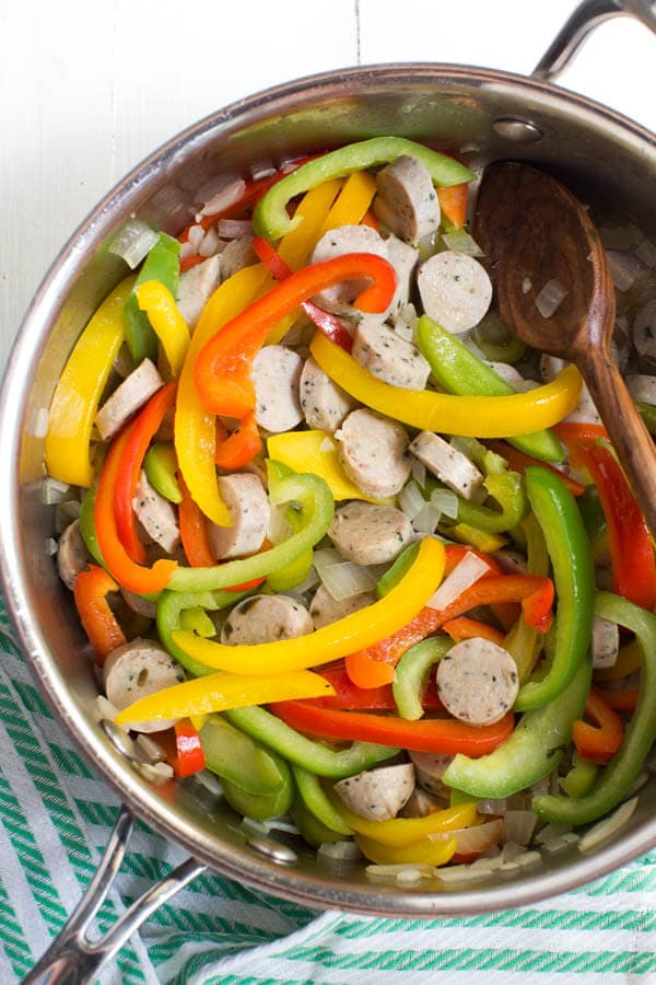 Skillet Fajita Chicken Sausage and Rice is made in one skillet and comes together in little time. Fresh bell peppers, onions, chicken sausage, fajita seasoning and rice are combined to create a meal for the entire family!