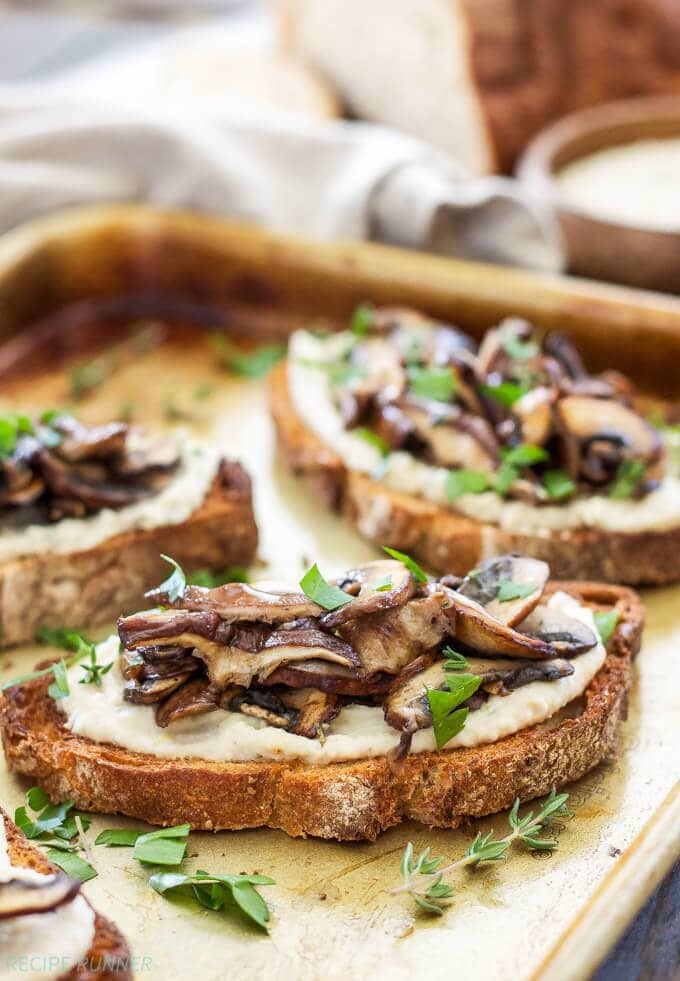 Lemon Rosemary White Bean Toasts with Mushrooms | Creamy white beans spread on crunchy whole grain toast and topped with a sautéed blend of mushrooms. They’re great for any meal or an afternoon snack!