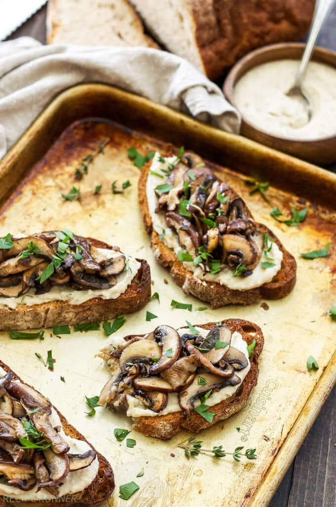 Lemon Rosemary White Bean Toasts with Mushrooms | Creamy white beans spread on crunchy whole grain toast and topped with a sautéed blend of mushrooms. They’re great for any meal or an afternoon snack!