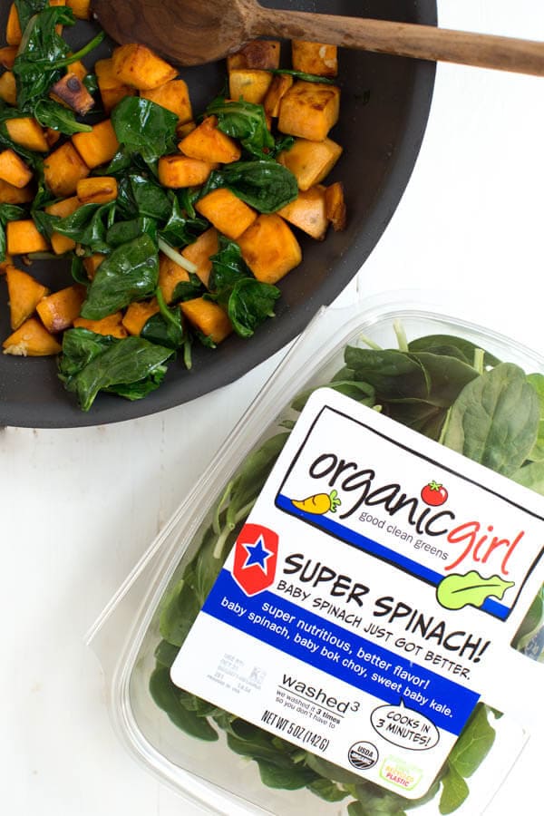 Sautéed Sweet Potato and Greens Breakfast Bowl is made with sweet potato, fresh greens, black beans, tomatoes, cheese, egg and avocado! This simple and healthy meal is perfect for any day of the week. 