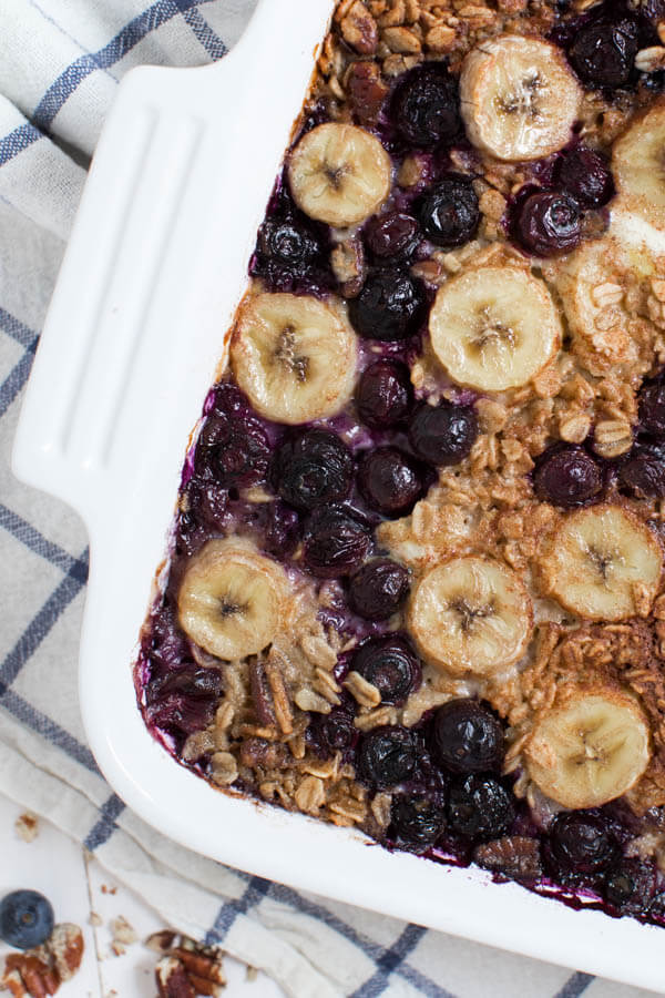 Banana Berry Crunch Baked Oatmeal is a simple, healthy and delicious way to start your day! This easy recipe is made with coconut milk, rolled oats, fresh bananas, berries and maple syrup.