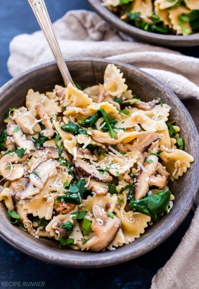 a bowl of creamy mushroom and spinach pasta