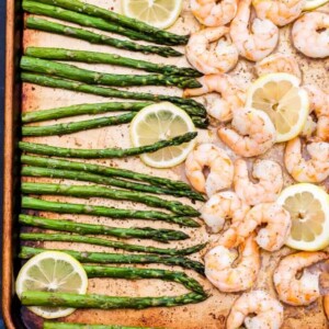 Sheet pan Lemon Roasted Shrimp and Asparagus with Herbed Couscous is one of the easiest dinners I've made and It's full of gourmet flavor! It can be on the table in 15 minutes or less!