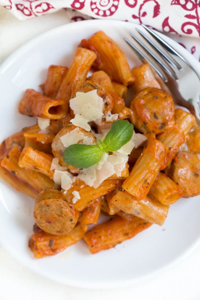 Chicken Rigatoni Pasta Skillet comes together in under 30 minutes and cooks in one pot to make clean up easy! Kids and adults will love this simple meal made with chicken sausage, rigatoni, pasta sauce, cheese and more.