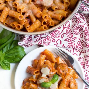 Chicken Rigatoni Pasta Skillet comes together in under 30 minutes and cooks in one pot to make clean up easy! Kids and adults will love this simple meal made with chicken sausage, rigatoni, pasta sauce, cheese and more.