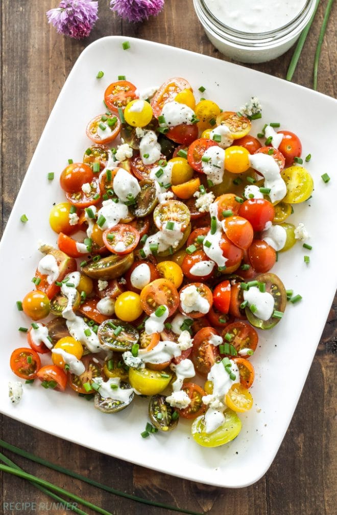 Sweet heirloom tomatoes topped with homemade creamy blue cheese dressing is the perfect, fresh summer salad! www.reciperunner.com