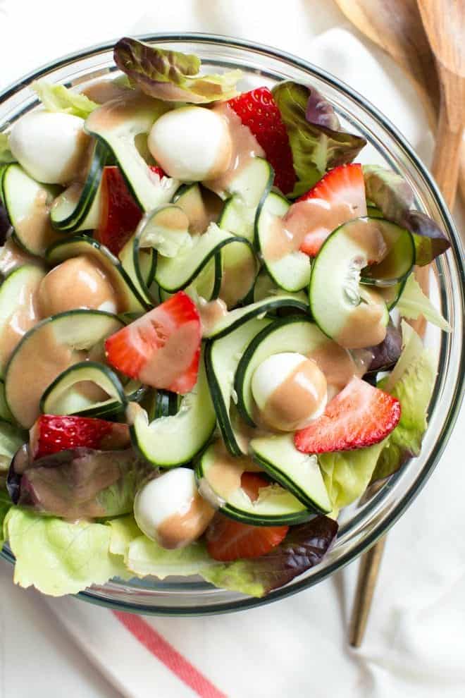 Strawberry, Cucumber and Mozzarella Salad is made with only five ingredients including a flavorful pomegranate balsamic dressing! Enjoy as a side or main dish for summer or all year long. 