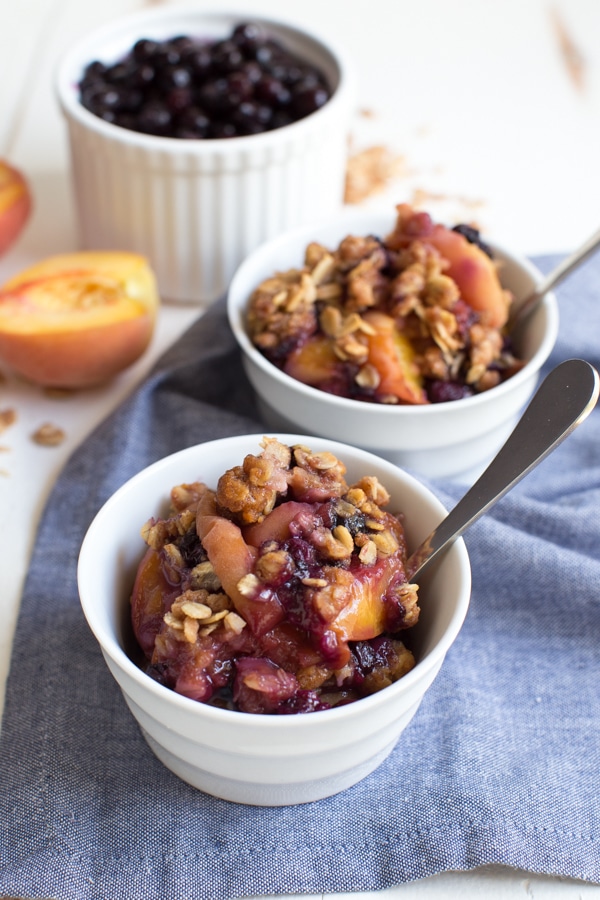 Grilled Peach and Blueberry Crisp is made with only a few simple ingredients including fresh peaches, wild blueberries and crisp oat topping! The fresh crisp is cooked on the grill so you don't even have to turn on the oven.