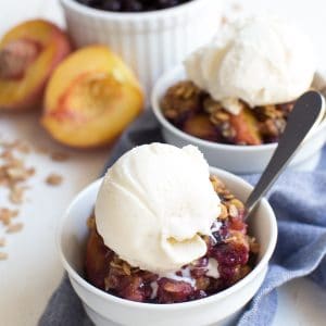 Grilled Peach and Blueberry Crisp is made with only a few simple ingredients including fresh peaches, wild blueberries and crisp oat topping! The fresh crisp is cooked on the grill so you don't even have to turn on the oven.