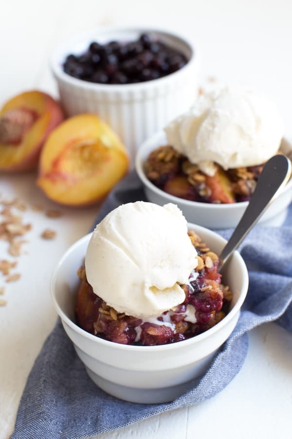 Grilled Peach and Blueberry Crisp is made with only a few simple ingredients including fresh peaches, wild blueberries and crisp oat topping! The fresh crisp is cooked on the grill so you don't even have to turn on the oven.