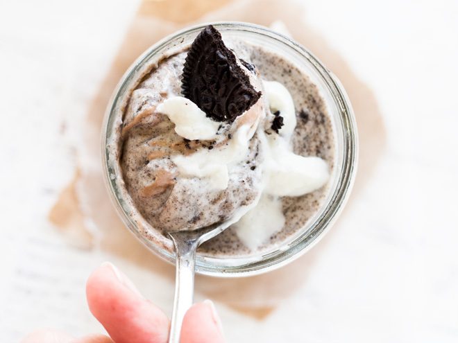 Chocolate cookie cheesecake parfait is served in mason jars for the perfect individual size