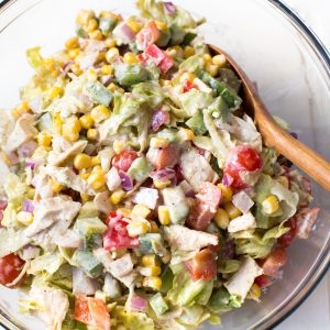 Creamy Chicken Fajita Chopped Salad comes together in less than 15 minutes! It is packed with fresh veggies, butter lettuce, creamy white cheddar dressing and fajita seasoning.