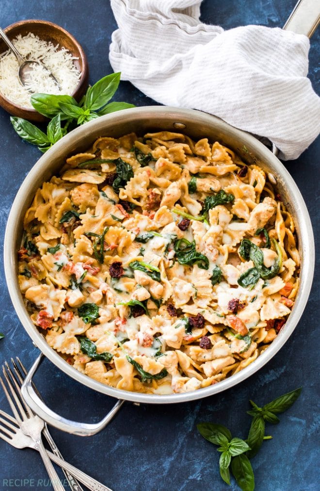 One Pot Creamy Sun Dried Tomato and Spinach Pasta with Chicken is an easy to make dinner the whole family will love! You won't believe there isn't a drop of cream in this flavorful, healthy pasta dish!