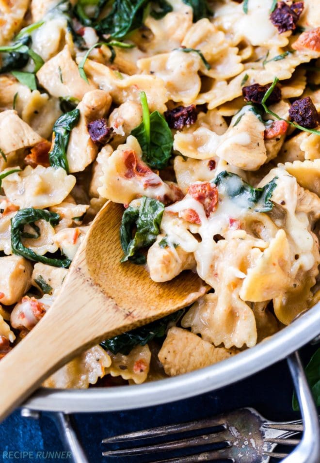 One Pot Creamy Sun Dried Tomato and Spinach Pasta with Chicken is an easy to make dinner the whole family will love! You won't believe there isn't a drop of cream in this flavorful, healthy pasta dish!