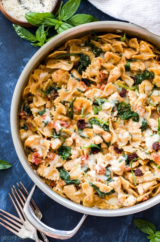 One Pot Creamy Sun Dried Tomato and Spinach Pasta with Chicken is an easy to make dinner the whole family will love! You won't believe there isn't a drop of cream in this flavorful, healthy pasta dish!