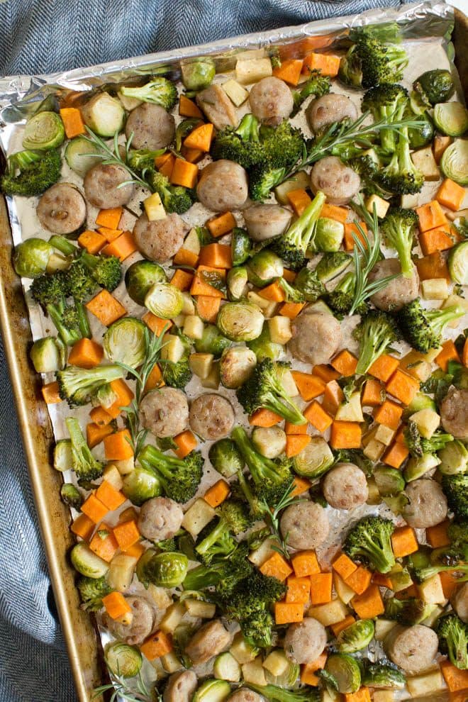 One pan chicken sausage with roasted vegetables and apples is an easy sheet pan meal that is made in less than 30 minutes! A few simple ingredients creates a flavorful fall meal.