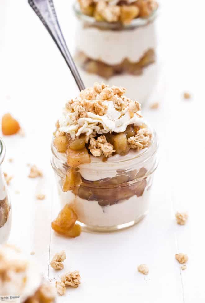 Apple Crisp Cheesecake Parfaits are the perfect dessert for fall and the upcoming holidays! Layers of creamy cinnamon cheesecake, apple pie filling and all topped off with crunchy granola and whipped cream.