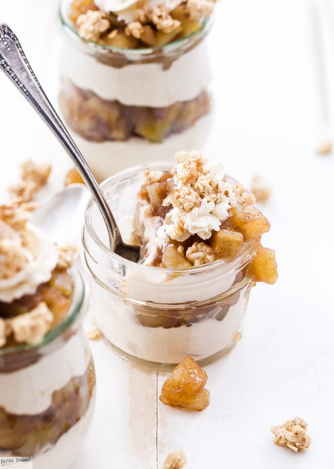 Apple Crisp Cheesecake Parfaits are the perfect dessert for fall and the upcoming holidays! Layers of creamy cinnamon cheesecake, apple pie filling and all topped off with crunchy granola and whipped cream.
